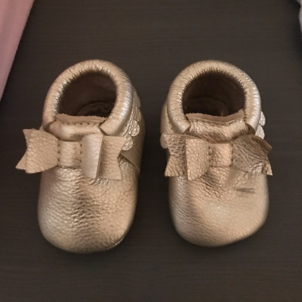 Freshly picked platinum bow moccasins size 1.